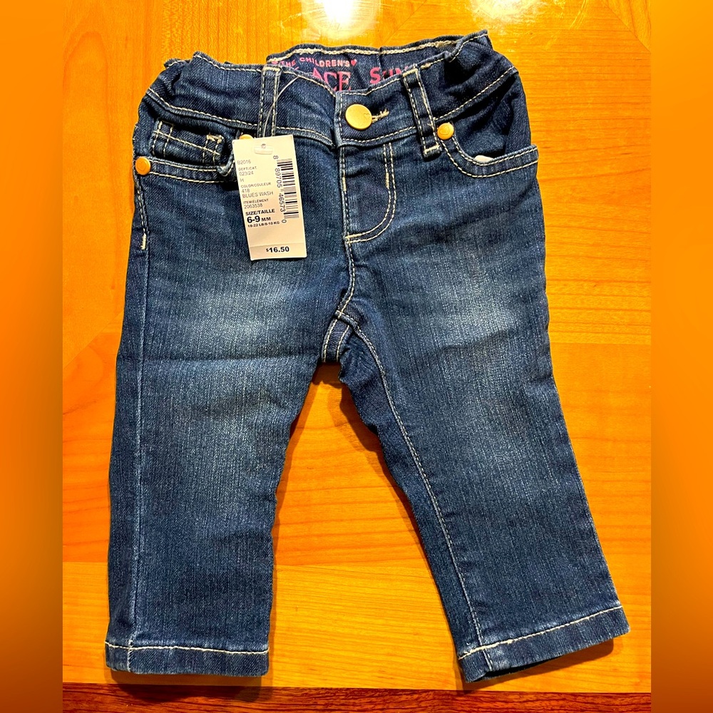 Baby girl’s blue jeans